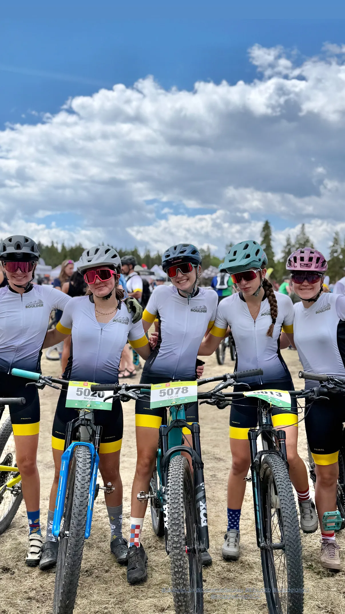 Five Boulder High riders in team kit at a race start line